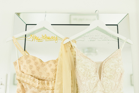 two dresses personalized hangers Blush and Gold Summer Indian-American Wedding - 48 Fields Wedding Barn | Northern VA