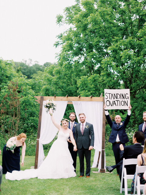 fun standing ovation sign spring wedding ceremony exit - 48 Fields Wedding Barn | Northern VA