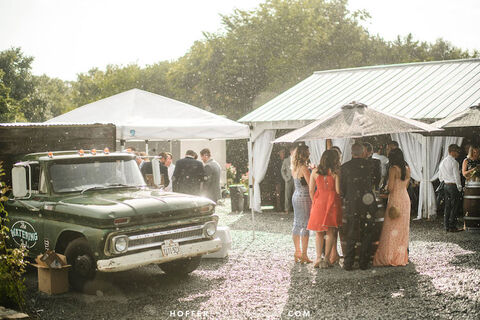 outdoor cocktail hour stormy summer wedding planning - 48 Fields Wedding Barn | Leesburg VA